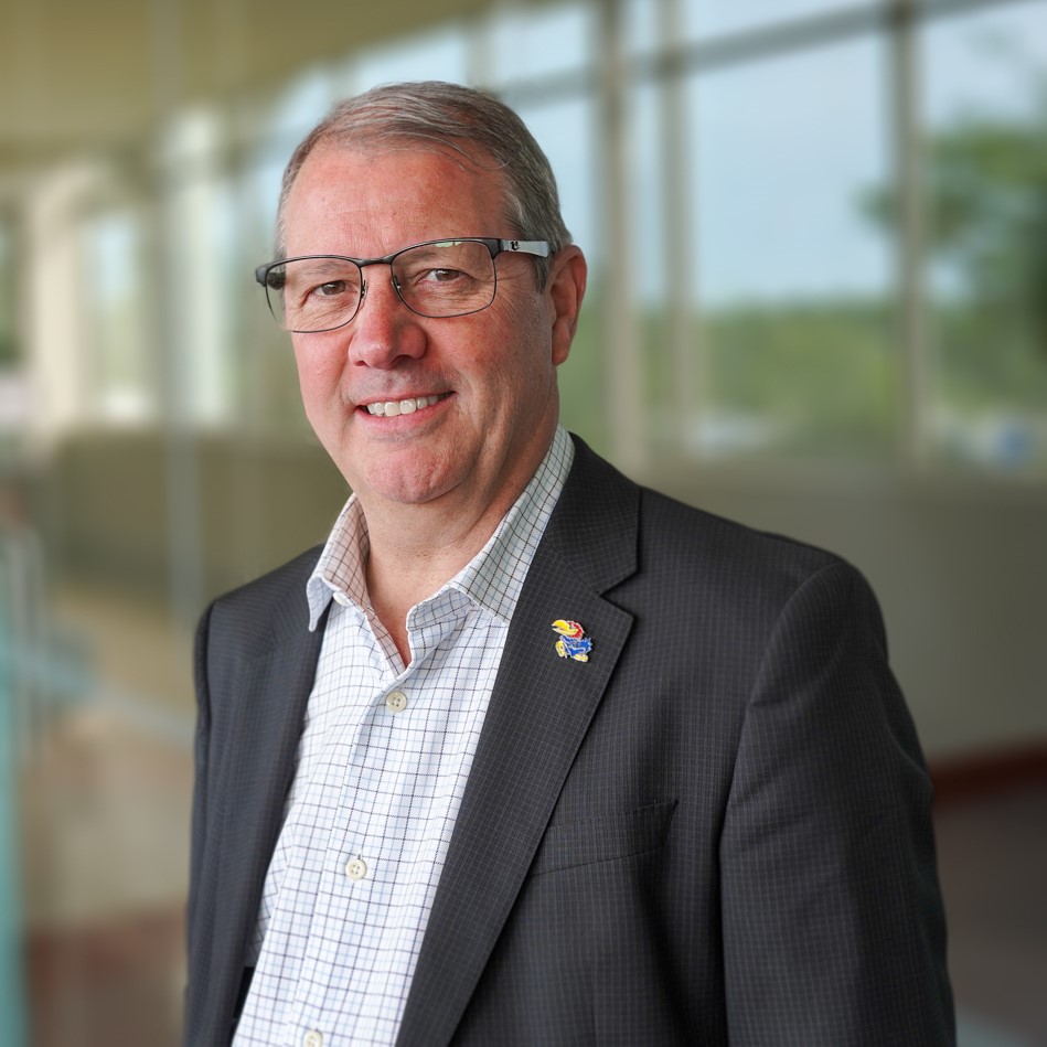 Staff-Photos-6-sq A portrait of Kerri Johnson smiling